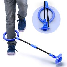 a person standing on the ground with a blue push mop attached to it's handle