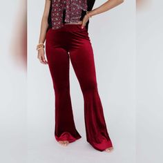 Say hello to our iconic Cher Flare Pants that are amazingly comfortable in stretch fabric with a high - rise and bell - leg to elongate your stride. These go - everywhere pants have an unfinished hem that give you the freedom to cut the length and let them fray for all your come - what - may kind of days! *Due to lighting and differences in monitors, actual colors may vary slightly from what appears online. Model is 5'6" and wearing a size Small. Approximate measurements are as follows: SMALL: Waist: 26", Inseam: 35", Length: 42 1/2" MEDIUM: Waist: 28", Inseam: 36", Length: 43" LARGE: Waist: 30", Inseam: 36.5", Length: 43 1/2" X - LARGE: Waist: 32", Inseam: 37", Length: 44" Please note this measurement is with the product unstretched.* 96% Polyester, 4% Spandex Hand wash cold, Lay flat to Burgundy Melina Pants, Red Bell Bottoms Jeans, Santa Flare Pants, Iconic Cher, Striped Slippers, Velvet Flare Pants, Velvet Flares, Polyester Spandex Fabric, Striped Cardigan