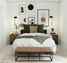 a bed with pillows, blankets and pictures on the wall above it in a bedroom