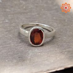 "Silver Oval Shape Garnet Ring astrology purpose for men's and women's Metal : 925 Sterling silver Stone : Natural Hessonite Garnet (Gomed) Size : 4 to 11 Ct. Shape : Oval Cutstone Gomed (Hessonite Garnet) is all the name of same stone which is the stone for Rahu. Gomed (Hessonite Garnet) is the gemstone for Rahu and by wearing Gomed (Hessonite Garnet) stone one gets relief from the atrocities of Rahu which it does on the native if it is not beneficially placed in horoscope. The Gomed (Hessonite Garnet) brings peace and happiness in life. By wearing it you could be able to neglect all the bad and negative impacts of the Rahu and your enemy's bad vision upon you. The Gomed (Hessonite Garnet) stone is very beneficial for people pursuing public speaking as its wearer influence over large crow Oval Spiritual Ring With Polished Finish, Oval Spiritual Rings With Polished Finish, Oval Sterling Silver Rings With Si Clarity, Oval Sterling Silver Ring With Si Clarity, Classic Oval Rings With Si Clarity, Modern Silver Ruby Ring With Oval Shape, Silver Oval Ruby Ring Spiritual Style, Spiritual Oval Sterling Silver Rings, Sterling Silver Ruby Ring With Polished Finish