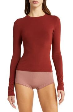 A tried-and-true classic, this fitted long-sleeve T-shirt cut from stretch-cotton jersey is from Kim Kardashian's highly sought-out SKIMS. 21" length (size Medium) Crewneck Long sleeves 90% cotton, 10% elastane Machine wash, tumble dry Imported Fashion Creator, Pop Of Red, Ribbed Turtleneck Sweater, Jersey Long Sleeve, Runway Trends, Fashion Week Runway, Flutter Sleeve Top, Big Fashion, Red Outfit