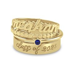 This personalized four-piece ring set is a beautiful graduation gift they’ll adore. Select your choice of metal One ring features a name, eight characters max, sculpted in a script font cross the center Add a line of engraving, eight characters max, to be inscribed along a wider band The third ring is set with the birthstone of your choosing A scalloped accent band completes the ensemble Personalized Yellow Gold Stackable Rings, Customizable Elegant Sterling Silver Birthstone Ring, Custom Name Engraved Yellow Gold Ring, Customizable 14k Yellow Gold Stackable Rings, Elegant Adjustable Engraved Ring As Personalized Gift, Elegant Adjustable Engraved Ring For Personalized Gift, Elegant Custom Name Stackable Rings For Anniversary, Customizable 14k Gold Nameplate Ring, Personalized Sterling Silver Birthstone Ring