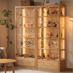 a wooden cabinet filled with lots of toy figurines on top of glass shelves