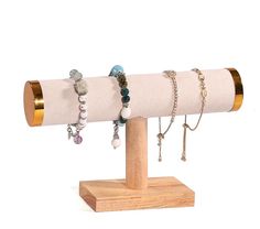 a wooden stand with several bracelets on it