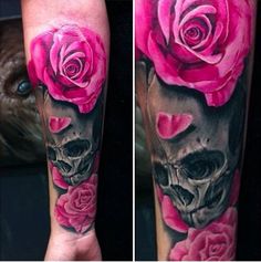 a skull and pink roses tattoo on the arm