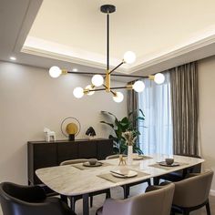 an elegant dining room with marble table and chairs