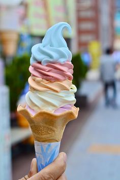 an ice cream cone with pastel colors on it