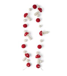 a red and white garland with marshmallows attached to it on a string