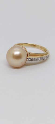 GOLDEN South Sea Pearl Ring 14k. Diamond Pearl Engagement Ring, Vintage Pearl Engagement Ring,14K Yellow Gold Golden South Sea Pearl. 10-11mm Pearl Ring with yellow Mother of Pearl and Diamonds. Product Info: - Stone: Golden South Sea, Yellow Mother of Pearl and Diamonds. - Pearl Color: Golden. - Pearls size: 10-11mm round. - Sparkling diamonds. - Metal: 14K Yellow Gold. - Ring Size 7 - Made in USA. - Nice Gift Box Included Luxury Hallmarked Yellow Gold Pearl Ring, Luxury Yellow Gold Brilliant Cut Pearl Ring, Pearl Engagement Ring Vintage, South Sea Pearl Ring, Pearl Engagement Ring, Golden South Sea Pearls, Vintage Pearl, Sea Pearl, South Sea Pearls