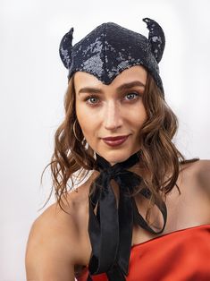 The headpiece features black sequin fabric and playful horns, making it a perfect addition to any costume.  One size fits most, head circumference- 22-23 inches.  Lightweight and comfortable to wear all night long. The bonnet is completely lines and has long ties, which you can tie into a bow, leave hanging like a scarf, or style however you like. Fits a variety of Halloween and Cosplay costumes. Pair it with your evening outfit and turn it into a Halloween or party costume with just one headpie Black Horned Costume Hats For Cosplay, Black Horned Costume Hats And Headpieces, Black Cat Ears Fantasy Costume Accessories, Black Fantasy Cat Ears Costume Accessories, Black Cat Ears Costume Hat For Cosplay, Fitted Novelty Costume Accessories With Cat Ears, Gothic Black Costume Accessories With Ears, Black Fantasy Costume Accessories With Ears, Fantasy Black Costume Accessories With Ears