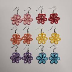 Quilled flower drop earrings in various colors.   Flowers measure about one inch across. Quilling Earring Patterns, Red Flower-shaped Earrings For Spring, Handmade Flower-shaped Earrings For Spring, Handmade Spring Flower-shaped Earrings, Spring Multicolor Flower Earrings, Red Flower Shaped Earrings For Spring, Handmade Multicolor Flower Earrings, Multicolor Handmade Flower Earrings, Spring Flower Earrings With Ear Wire