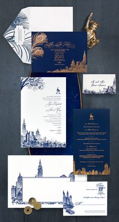 the wedding stationery is laid out on top of each other