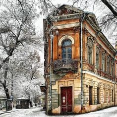 an old building in the middle of winter