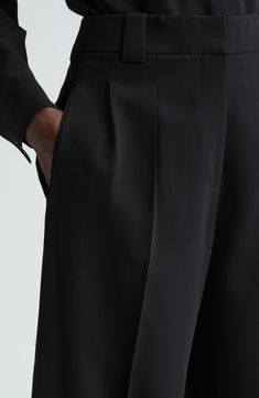 These pleated high-waist pants are immaculately tailored in a cuffed barrel-leg silhouette from signature Finesse crepe that's tactile with impeccable drape. Precision darting in back lends a flawless fit. 27" inseam; 19" leg opening; 12 1/2" front rise; 18" back rise (size 8) Zip fly with hook-and-bar closure Side-seam pockets; back welt pockets 71% acetate, 29% polyester Dry clean Imported Designer Clothing Classic Wide-leg Pants With Pleated Waist, Formal Pantsuit With Pressed Crease Trousers, Formal Pantsuit With Pressed Crease, Elegant Pantsuit With Pressed Crease Trousers, Classic Wide-leg Pantsuit, Formal Wide-leg Pants With Pleated Waist, Elegant Evening Pantsuit With Ankle-length Pants, Classic Pantsuit With Pressed Crease, Formal Wide-leg Pants With Pressed Crease