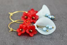 Beautiful earrings with cherry blossoms in light blue and red. Total length about 6cm Length of the pendant approx. 3.5 cm brass, acrylic, glass Vintage Blue Hoop Earrings For Gift, Blue Vintage Hoop Earrings As Gift, Blue Vintage Hoop Earrings For Gifts, Blue Vintage Hoop Earrings For Gift, Handmade Red Hoop Earrings For Wedding, Blue Flower-shaped Hoop Earrings, Blue Flower Hoop Earrings Gift, Blue Flower Hoop Earrings As Gift, Blue Flower Shaped Hoop Earrings