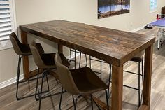 a dining room table with chairs and a ping pong table