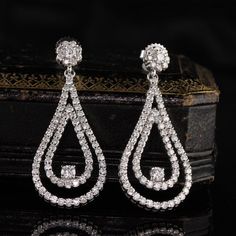 Stunning and elegant diamond drop earrings.Item #JP-E0021Metal: 14K White GoldWeight: 9.9 GramsDiamond Weight: Approx. 4 ctDiamond Color: HDiamond Clarity: SI1Measurements: 44.85 x 18.74 mmLayaway: For your convenience, we will be happy to provide layaway payment options. Please contact us to work out a layaway plan which best suits your needs. All layaway purchases are final sale.All domestic and international shipments are shipped with FedEx insured with signature required. International Shipm Argentium Silver Jewelry, Emerald Eternity Band, White Gold Diamond Earrings, Vintage Drop Earrings, Cluster Engagement Ring, Gold Diamond Earrings, Argentium Silver, Diamond Drops, Diamond Drop Earrings