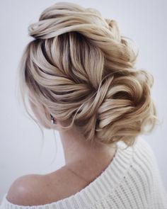 a woman with blonde hair in a low bun hairstyle on her instagram page