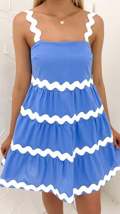 Turn heads in this vibrant blue mini, boasting playful ric rac tiers. Light Blue Mini Dress With Ruffle Hem, Cute Light Blue Mini Dress With Ruffles, Cute Tiered Mini Dress With Ruffle Hem, Cute Spring Mini Dress With Tiered Skirt, Cute Summer Mini Dress With Tiered Skirt, Cute Tiered Mini Dress For Summer, Cute Tiered Skirt Mini Dress For Summer, Casual Fitted Blue Tiered Dress, Light Blue Ruffled Mini Sundress