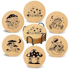 six wooden coasters with black and white illustrations on them, each featuring different types of mushrooms