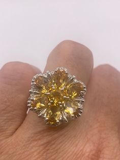 Vintage citrine flower ring Unusual cut in 925 sterling silver setting Handmade Size 6.25 or 6.5  Can be resized, my jeweler charges $20  All rings are shipped in a nice gift box.   Check out our over a THOUSAND great reviews Engraving is $4 per letter and is not always perfect depending on the piece. It can take a few days if the jeweler is busy. This is payable to Paypal Judithsltd@gmail.com  PLEASE NOTE If we have multiples of the same vintage item, it is because we often purchase factory rem Yellow Flower-shaped Formal Jewelry, Formal Yellow Flower-shaped Jewelry, Yellow Flower Shaped Jewelry For Formal Occasions, Formal Gemstone Rings With Flower Shape, Formal Flower Shaped Gemstone Rings, Formal Flower-shaped Gemstone Rings, Yellow Flower Ring For Anniversary, Yellow Flower Shaped Jewelry For Anniversary, Yellow Flower-shaped Jewelry For Anniversary