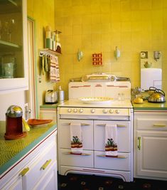 an old fashioned white stove in a yellow kitchen