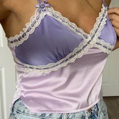 Urban Outfitters Satin Tank Top Cami Straps Adjustable With Cute Purple Roses At Bases (Y2k) Color Is Lilac Dark Purple On Top Lace Details With Purple Ribbon Weaved In And Out Base Is A Darker Shade Of Purple Cropped With 2 Side Slits Size Med Measurements Approx- 16” Pit To Pit Laying Flat 16-18.5” Long If Straps Are Extended Brand New With Tags Fitted Purple Top With Lace Trim, Fitted Purple Camisole For Spring, Fitted Camisole Tops By Urban Outfitters, Urban Outfitters Tops With Lace Trim For Spring, Urban Outfitters Fitted Camisole Top, Fitted Purple Cotton Camisole, Fitted Lavender Camisole, Fitted Lavender Camisole Top, Satin Tank Top