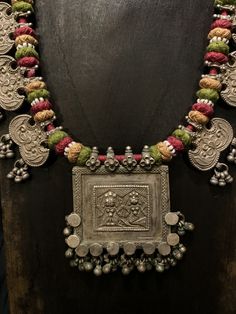 Get lost in the detail and unique beauty of antique silver Banjara beads strung onto a beautifully woven cord, handcrafted in India. All of our jewelry is one of a kind, handmade, and fair trade. A truly one of a kind piece, this necklace features the breathtaking intricacy of century old Banjara silverwork which is gracefully contrasted by the colorful and intricate woven cord they’re strung upon. The Banjara are one of the ancient nomadic tribes in India and have been known for centuries for t Bohemian Handmade Beaded Necklaces For Traditional Ceremonies, Traditional Handmade Beaded Necklaces For Ceremonies, Traditional Handmade Necklaces For Festival, Handmade Traditional Necklace For Festivals, Artisan Handmade Necklaces For Traditional Ceremonies, Handmade Artisan Necklace For Traditional Ceremonies, Handmade Artisan Necklaces For Traditional Ceremonies, Traditional One-of-a-kind Necklaces For Ceremonial Occasions, Traditional One Of A Kind Necklaces For Ceremonial Occasions