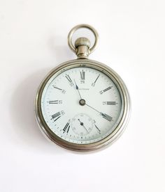 15 jewel, Waltham pocket watch from around 1902. The movement is in perfect working order having been fully cleaned, oiled, and tested. The Silveroid case (fake silver) is in great shape with only small age marks, one small ding at the very bottom. The bow is tight and it has a good crown.  The dial is in perfect shape with  no hairline cracks or chips.  The Original thick glass crystal is in good shape, usual scuffing/ light scratches from many years of use but overall very good for its age. Sl Antique Silver Pocket Watch With Subdials, Classic Silver Pocket Watch With Stopwatch, Classic Silver Pocket Watch For Collectors, Timeless Silver Pocket Watch With Stopwatch Feature, Silver Timeless Pocket Watch With Stopwatch, Silver Timeless Pocket Watch For Collectors, Clock Display, Carriage Clocks, Paris Shopping