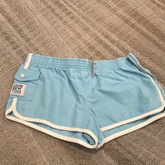 Victorias Secret (Pink) Blue Shorts. In Great Condition- Never Worn. Tags Still On! Sporty Beach Season Bottoms With Pockets, Sporty Beach Bottoms With Pockets, Sporty Bottoms With Pockets For Beach Season, Blue Pajama Shorts With Pockets For Spring, Light Blue Lounge Shorts With Pockets, Light Blue Short Bottoms For Beach, Light Blue Casual Beach Bottoms, Light Blue Casual Bottoms For Beach Season, Blue Shorts With Pockets For Poolside