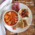 a white plate topped with lots of food on top of a wooden table next to a bowl of soup