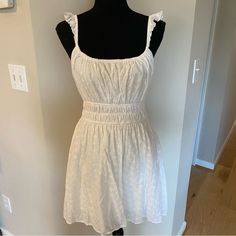 Originally Purchased From Red Dress Boutique And Never Worn! A Gorgeous, Light Summer Top/ Mini Dress. The Rayon Lining Feels Silky Against The Skin And The Cotton Makes It Super Light. The Empire Waist Creates A Beautiful Silhouette. A Must Have For The Summer Or Vacation By The Water! Let Me Know If You Have Any Questions. Measurements Laying Flat Approximately: Armpit- Armpit: 19" Waist:14" (Can Stretch To 17") Shoulder- Hem: 34" Ships Within One Business Day Of Sale From A Smoke Free Home Casual Eyelet Dress For Brunch, White Casual Eyelet Dress, Casual Eyelet Mini Dress For Brunch, Casual Eyelet Dress For Day Out, Casual Fitted Mini Dress With Broderie Anglaise, Casual Broderie Anglaise Mini Dress For Day Out, Cotton Sundress With Lace Trim For Brunch, Casual Swiss Dot Dress For Brunch, Casual Swiss Dot Dress For Spring