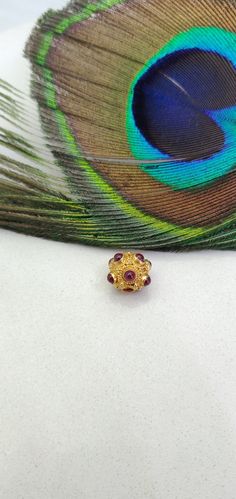 Thank you for riching to our shop! The beautiful handmade ball bead is the perfect finding for DIY jewelry making and can be used in multiple different ways and designs. Country of Manufacture: India Metal: Gold Size: 9 MM Metal Purity: 18K Color: Yellow Shape: Ball Stone: Hydro Red Hole Size: 2 MM Item Number: KC2026 This influential product belongs to our 18k gold Charm ball beads collection. Primarily manufactured in INDIA, this necklace or bracelet gold ball bead has entirely made of solid y Gold Gemstone Round Beads, Gems And Cabochons, Gold Gemstone Beads And Cabochons, Red Rondelle Spacer Beads Jewelry, Yellow Gold Ruby Bead Jewelry, Traditional Tiny Beads Bracelet, Festive Temple Jewelry In Gold, Traditional Gold Bracelets With Tiny Beads, Ceremonial Polished Round Beads Jewelry, Ruby Jewelry With Polished Beads