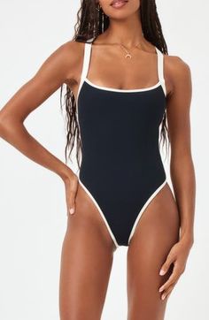 Contrast trim lends sporty appeal to this open-back one-piece swimsuit with allover ribbed texturing. Elasticized straps Cheeky back coverage 97% nylon, 3% spandex Spot clean Imported Bathing Suits For Vacation, Swimwear Small Chest, Aerie Swimsuits Bikinis, Classy Swimwear Bikinis, Trendy One Piece Swimsuit, Cute 1 Piece Swimming Suits, High Wasted Swimsuits For Women, Classy Bathing Suits, Cute Swimsuits One Piece