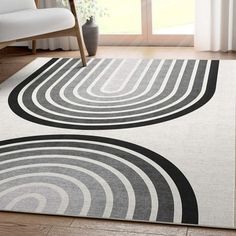 an area rug with black and white circles on it