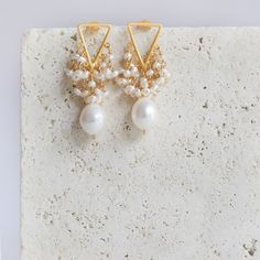 We thought we'd make fringe even better by adding pearls. - Beautiful white freshwater pearls- 1.25" long- Post backs- 14k gold plated .925 fine Italian sterling silver- Made in the USA in our NYC studio- Packaged in a gift box- Free shipping on US orders Handmade to last. Our unique gold plating technique makes our jewelry tarnish resistant. The nature of natural gemstones makes each style one-of-a-kind. White Gold Plated Dangle Bridal Earrings, White Gold Plated Dangle Pearl Earrings, White Gold Plated Chandelier Earrings As Gift, White Gold-plated Dangle Pearl Earrings, White Gold-plated Chandelier Earrings As Gift, Gold Plated Pearl Drop Chandelier Earrings, Gold-plated Chandelier Earrings With Pearl Drop, White Gold Plated Chandelier Earrings With Pearl Drop, White Gold-plated Chandelier Earrings With Pearl Drop