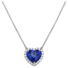 With this diamond and sapphire heart-shaped pendant, style and glamour are in the spotlight. This 18-karat diamond and sapphire heart-shaped pendant is made from 1.3 grams of gold. This pendant is adorned with VS2, G color diamonds, made out of 20 round diamonds totaling 0.23 carats and 1 sapphire totaling 3.02 carats. Aquarium Minecraft, Platinum Pendant, Titanic Jewelry, Heart Shaped Pendant, Heart Pendant Diamond, Modern Necklaces, Heart Shape Pendant, Modern Pendant, Yellow Sapphire