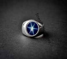 This Ring Features a 9X11 MM Oval Cabochon Natural Blue Lindy Star and Sterling Silver Finished with rhodium. Customization is available. It is made by hand, and it will take about 3 to 5 business days to finish the ring after your payment is completed. Product Description Main stone: Natural Blue Lindy Star Metal type: 92.5 Sterling Silver finished with rhodium How To take care of This Ring - Keep the jewelry away from direct heat, water, perfumes, deodorants, and other strong chemicals. Wipe t Classic Silver Star-shaped Jewelry, Silver Star-shaped Formal Jewelry, Classic Silver Star Shaped Rings, Silver Star-shaped Jewelry For Formal Occasions, Silver Star-shaped Jewelry For Formal Events, Silver Star-shaped Formal Rings, Silver Star-shaped Ring For Formal Occasions, Blue Star Sapphire Ring, Star Sapphire Ring