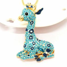 Betsey Johnson Giraffe Blue Rhinestone Gold NecklaceItem: Necklace Vendor: Betsey Johnson Necklace Chain Length: 27.5 Inches Pendant Dimensions: 2.68" x 1.73" (Inches) Color: Gold, Blue Metal: Alloy, Lead & Nickle Free Theme: Giraffe, Animals Measurements are approximate. Sold as One Individual Necklace. Fun pendants, flirty necklaces, bright brooches, and chunky bracelets do more than just add a touch of sparkle – they represent who you are. Betsey Johnson Jewelry does this beautifully with Betsey Johnson Necklace, Sweet Necklace, Animal Prints Pattern, Chunky Bracelets, Necklace Chain Lengths, Betsey Johnson Jewelry, Blue Rhinestones, Sparkling Crystal, Necklace Chain