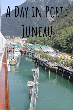 boats are docked in the water next to a dock with mountains in the background and text overlay that reads, a day in port juneau