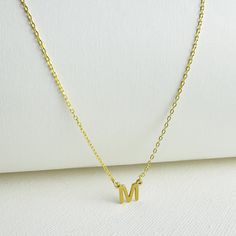 L E T T E R ∙ C H A R M ∙ N E C K L A C E  (MONOGRAM) * Base Material: High-Quality Solid 925 Sterling Silver. * Finish: Sterling Silver ∙ 18K Gold (A thick layer of gold plating) * Dimension: 7mm letter height *  All our necklaces are lovingly crafted by hand, and uniquely customized  ♡ H O W ∙ T O ∙ CUSTOMIZE  ∙  O R D E R 1) Select FINISH  2) Select LENGTH  3) Use the 'PERSONALIZATION BOX' to let us know the Initial you would like. (Example: M ) 4) Click "Add to Cart" 5) Proceed to Checkout 6) Complete order O T H E R ∙ I N F O R M A T I O N * The length option is the TOTAL chain length (including the charm). If you order an 18" chain, the piece will come as CHAIN + CHARM = 18". All pieces will come with a 2" extension chain. * All items have jewelry boxes. * 18K Gold provides tarnish r Classic Hypoallergenic Necklace For Anniversary, Classic Hypoallergenic Necklaces For Anniversary, Classic Gold Necklace For Mom's Gift, Classic Gold Necklace For Mom, Gold Hypoallergenic Necklace For Her, Hypoallergenic Gold Initial Necklace Gift, Hypoallergenic Gold Necklace For Mother's Day, Classic Hypoallergenic Necklace For Gift, Classic Hypoallergenic Necklaces For Gifts