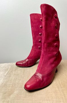 These are so fun! Enzo Angiolini boots from the later 1990's. They are obviously inspired by the Victorian era. These could be really fun with the right outfit! A great pop of color! They show very subtle and average signs of wear, but honestly appear well cared. Suede & leather with sweet little covered buttons up the side.  A darker magenta like pink, leaning towards burgundy, but still pink.  Size 8M. tone on tone, leather & suede. Please look over footbed measurements below as, sizing may ru Retro Ankle Boots For Winter, Vintage Wide Calf Mid-calf Boots For Fall, Retro Round Toe Mid-calf Boots For Winter, Retro Knee-high Boots For Fall, Retro Knee-high Fall Boots, Vintage Wide Calf Mid-calf Boots For Winter, Retro Knee-high Heeled Boots For Winter, Fall Boots With Button Closure And Round Toe, Vintage Pointed Toe Mid-calf Boots For Fall