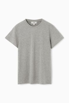 Channeling a '90s sensibility, this white T-shirt is cut in a shrunken, slim shape that contours the body. It's made from soft cotton-jersey blended with TENCEL™ Modal for lightness and is slightly shorter in length.  Slim fitTENCEL™ is a trademark of Lenzing AG. TENCEL™ Modal is made from sustainably sourced beech wood, a renewable raw material  Shell: 46% Cotton, 46% TENCEL™ Modal, 8% Elastane. Excluding trims / Machine wash Back length of size S is 22.95" / Model wears a size S Classic Fitted Cotton T-shirt, Classic Fitted Crew Neck T-shirt, Classic Fitted Gray T-shirt, Tailoring Jeans, Denim Sweater, Cardigan Shirt, Silk Print Dress, Vest Shirt, Home T Shirts