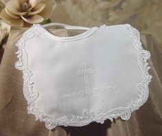 (6.5" x 6.5", White) This is a Girls Poly Satin Baptism Bib with Venise Lace and puff silk screened cross. Edged with Rayon Venise Trim. Backing is Polyester flannel. Hand Wash. Packaged in vinyl bag. Hand made in the U.S.A. Approximate size: 6.5 x 6.5 . Baby Boy Baptism Outfit, Boy Baptism Outfit, Baby Boy Baptism, Christening Outfit, Girls Bib, Baby Baptism, Girl Christening