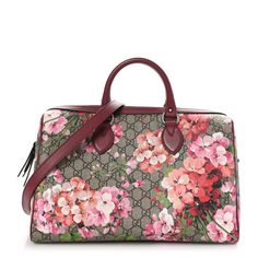 This is an authentic GUCCI GG Supreme Monogram Blooms Medium Boston in Beige, Multicolor and Dry Rose. This stunning handbag is crafted of Gucci GG monogram coated canvas. The bag features vibrant pink tone floral designs and deep rose colored top handles, an optional adjustable shoulder strap, matching leather trim with silver tone links and hardware. The top is open to a dark beige microfiber interior with zipper and patch pockets. Gucci Blooms Bag, Gucci Flowers Bag, Pink Luxury Gucci Shoulder Bag, Gucci Boston Bag, Dry Rose, Pink Gucci Bag With Gold-tone Hardware, Gucci Crossbody Bag, Gg Monogram, Luxury Gucci Bag With Gold-tone Hardware