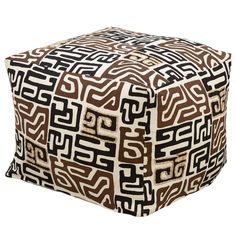 a brown and white ottoman cover with an abstract design