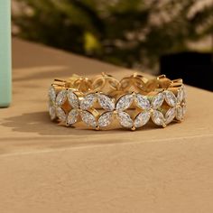 a diamond bracelet sitting on top of a table