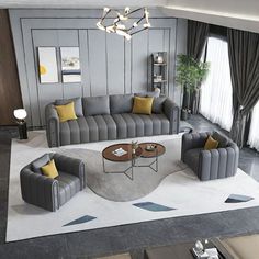 an aerial view of a living room with grey couches and yellow pillows on the rug