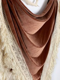 "We love the vibe of these boho inspired bridal wedding shawls. They are a super chic option for all brides! The unique, romantic design will add drama to your photos and make for a stunning accessory that all your guests will be talking about! A high-fashion handmade Arrow and Thread velvet shrug shawl is a gorgeous addition to your wedding look and we've got you covered! Literally! The handmade stretch velvet shawl wraps are made with high quality fabrics and trims. Each shawl has an open fron Bridal Velvet Shawl, Wedding Shawls And Wraps Fall, Vintage Shawl With Traditional Drape For Wedding, Vintage Wedding Shawl With Traditional Drape, Bohemian Shawl With Traditional Drape For Festivals, Bohemian Wedding Scarves With Traditional Drape, Bohemian Shawl Scarves For Wedding, Bohemian Shawl Scarf For Wedding, Bohemian Wedding Shawl Scarves