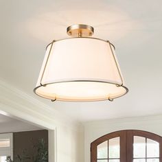 a light fixture hanging from the ceiling in a living room